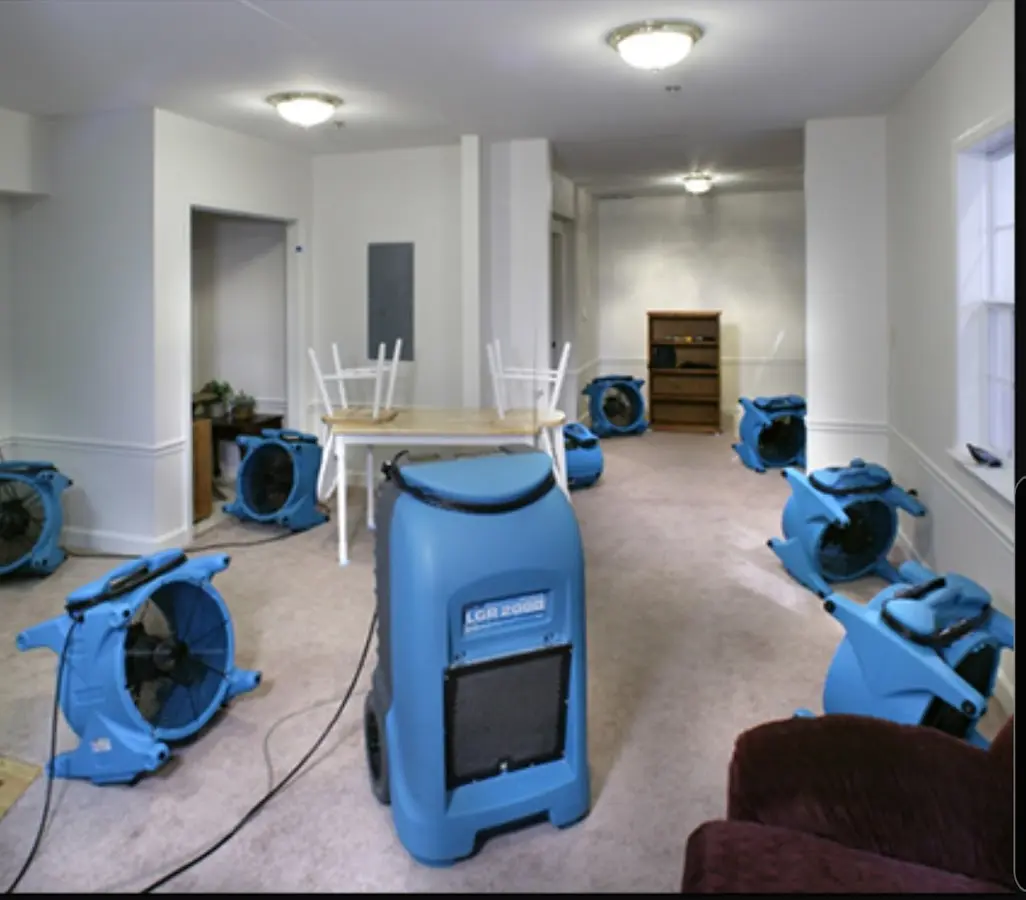 Air movers and dehumidifier setup for Water Damage Restoration in Lawrence